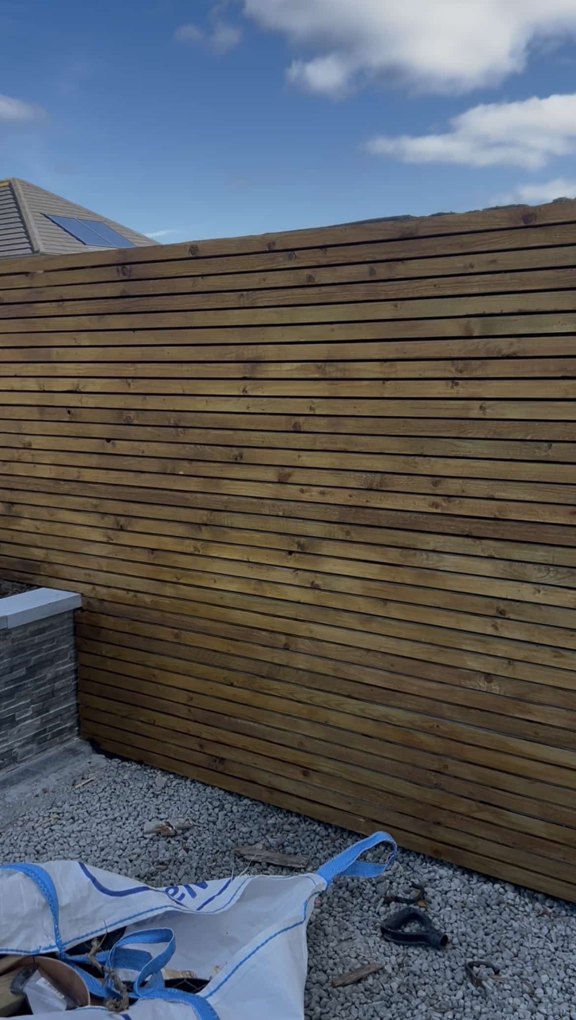 Modern venetian style fencing/slatted fencing on a paving contracting job in Galway